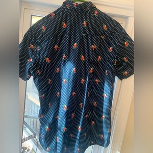 Free Planet Santa skiing button down shirt.